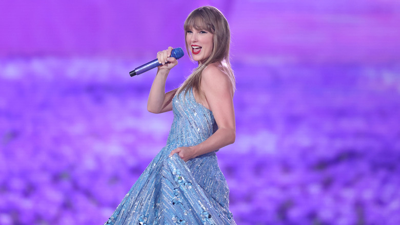 Taylor Swift wearing a sparkly dress during a performance in Stockholm