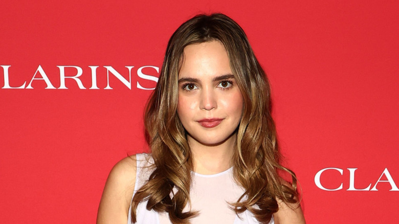 Bailee Madison poses for photos on a red carpet