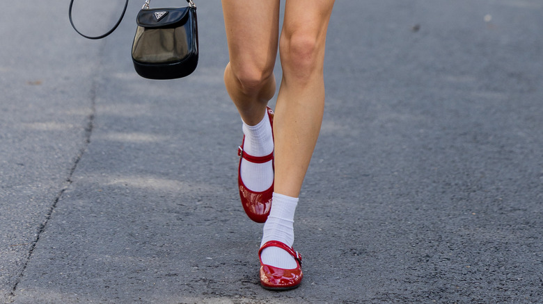 woman wearing red flats