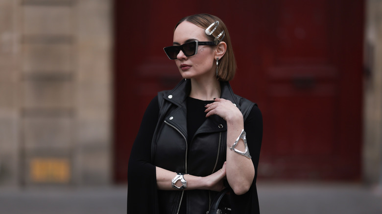 woman wearing silver cuff bracelets