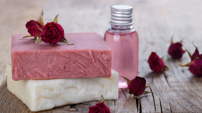 body wash and bar soap on table 