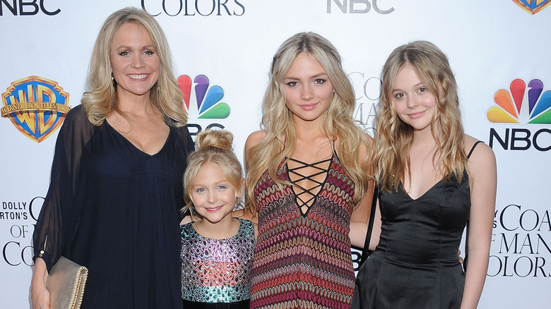 Barbara Alyn Woods poses on the red carpet with her three daughters, Alyvia, Natalie and Emily Lind.