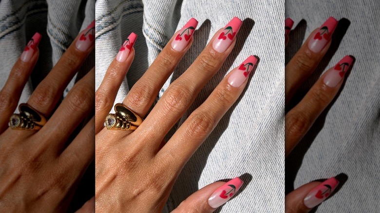 Barbiecore manicure with cherry hearts