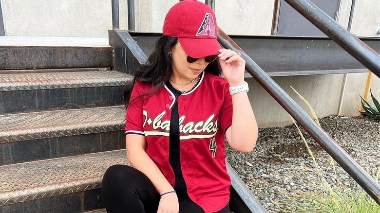 Girl in a baseball jersey