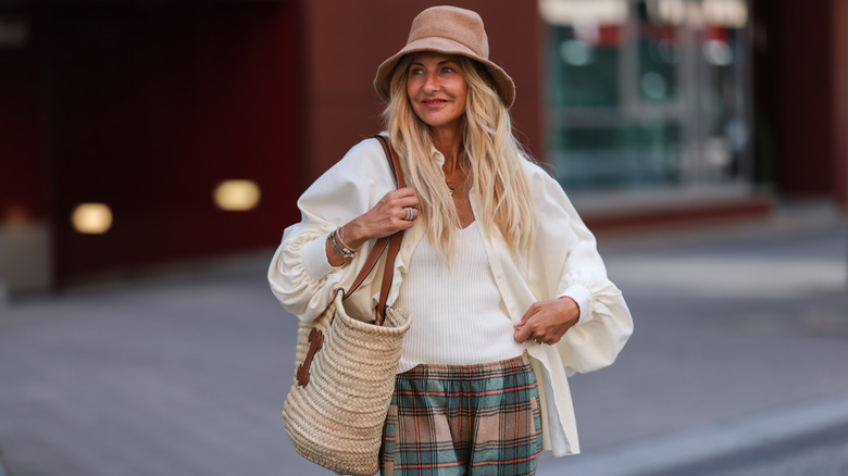 Woman carrying Celine basket bag