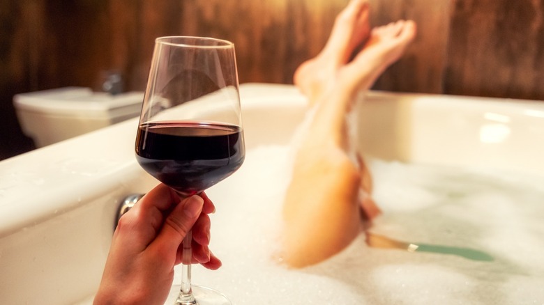 Glass of wine and bathtub