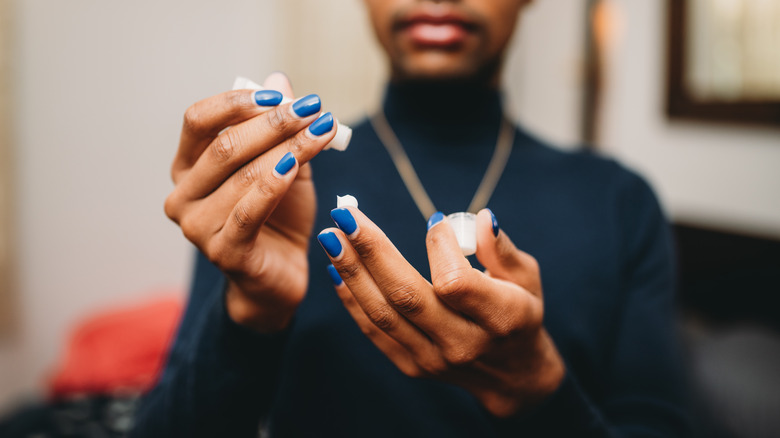 Woman using skincare-makeup cream