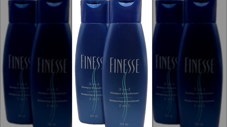 Two bottles of Finesse 2-in-1 shampoo and conditioner against a white background