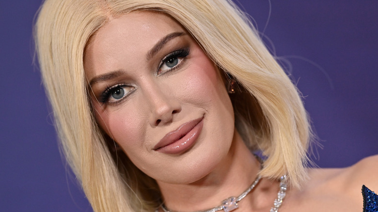 A close-up photo of Heidi Montag with heavy makeup, smiling.