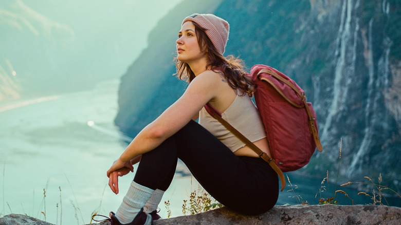 Woman sitting on a rock 