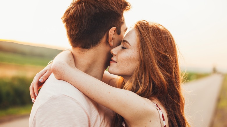 red-haired couple hugging