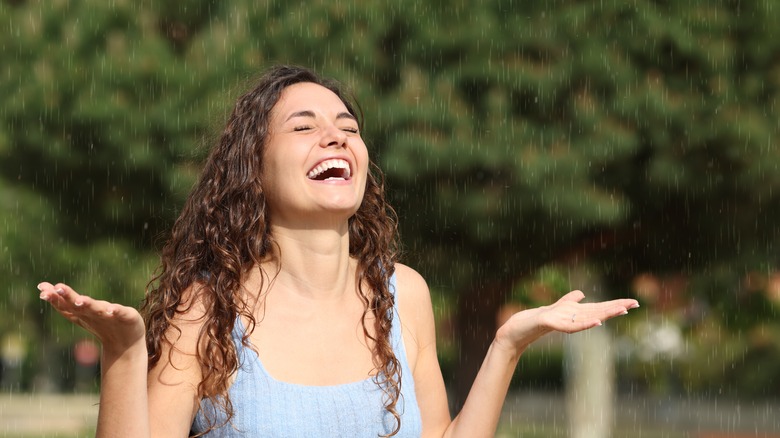woman smiling in rain