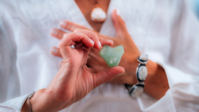 woman holding green aventurine