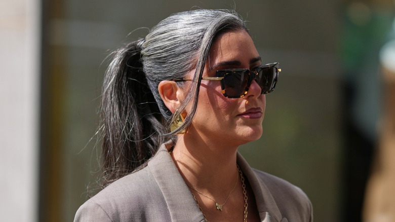 A woman with gray hair blended into a dark-brown base