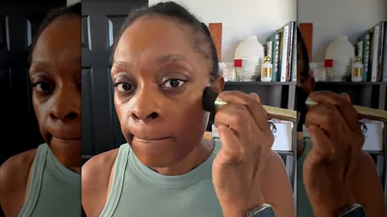 Woman applying Drunk Elephant foundation