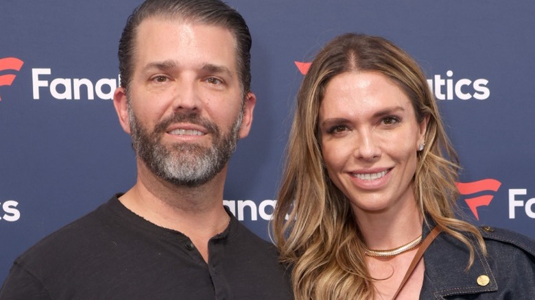 Donald Trump Jr. and Bettina Anderson pose at an event on Super Bowl weekend