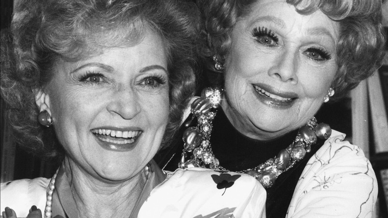 Betty White and Lucille Ball posing together