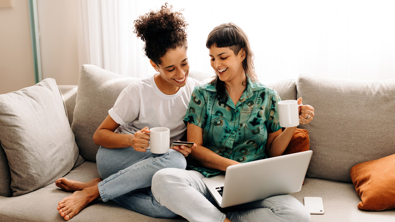 smiling couple on laptop