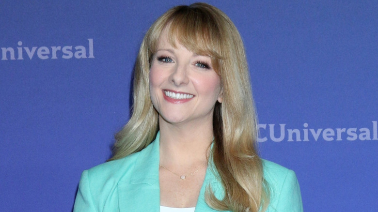 Melissa Rauch wearing a blue jacket