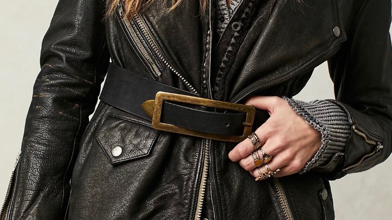 Big belt buckle over leather jacket