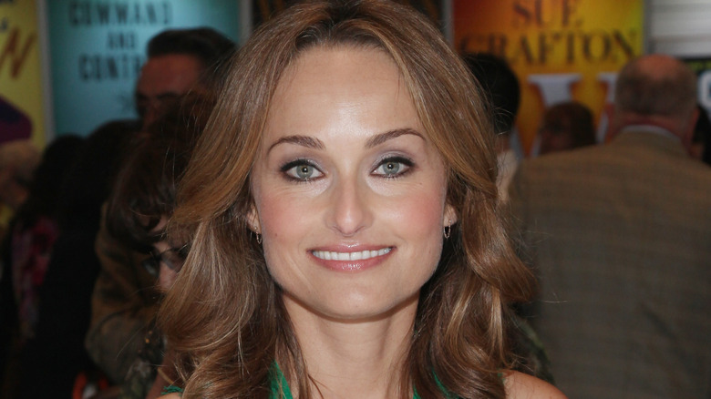 Giada De Laurentiis sports a smokey eye and pink lip gloss as she smiles for the camera