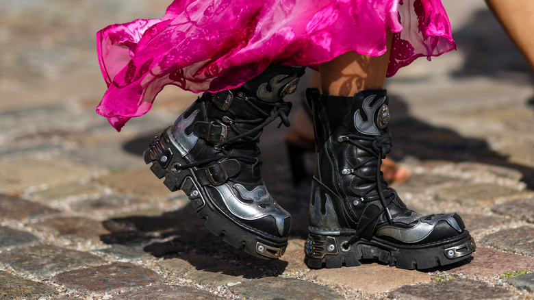 woman wearing black biker boots