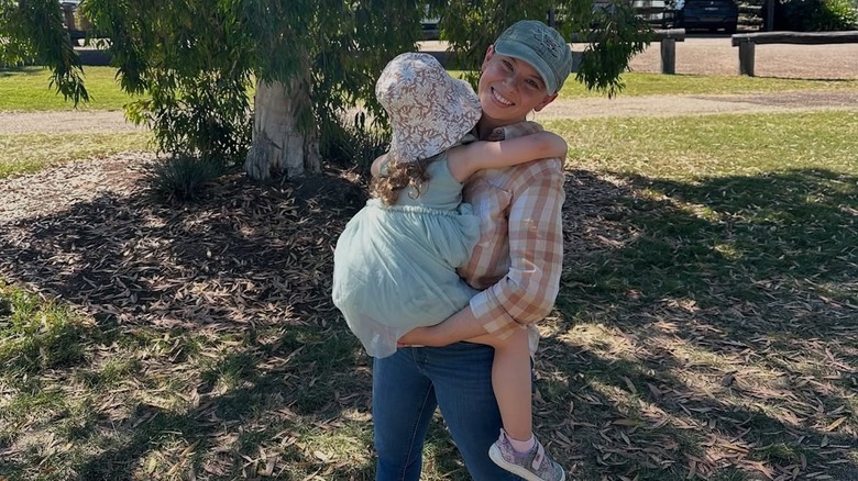 Bindi Irwin posing for a photo with her daughter Grace Warrior