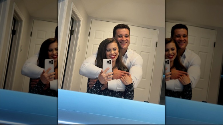 Bindi Irwin and Chandler Powell taking a mirror selfie