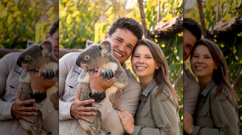 Bindi Irwin and Chandler Powell holding a koala