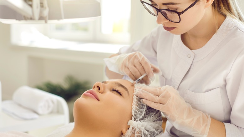 female doing skincare