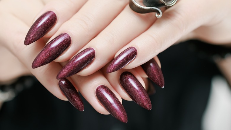 woman wearing dark cherry nails