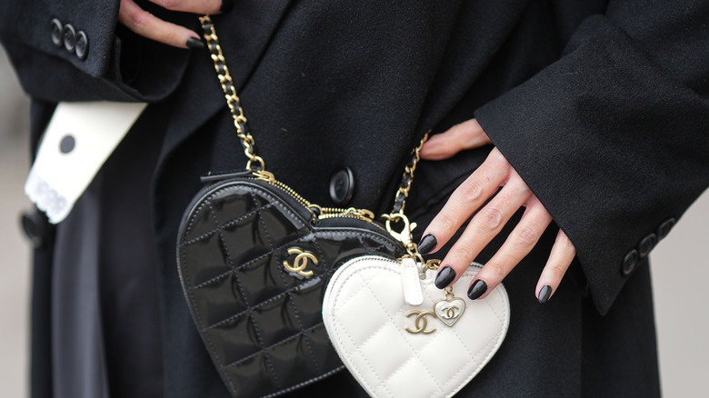 woman wearing black nail polish