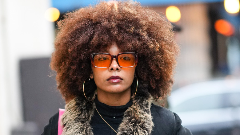 Woman wearing black lip oil