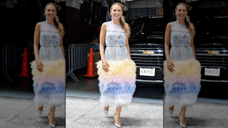 Blake Lively walking in a pastel maxi with a statement fringed bottom