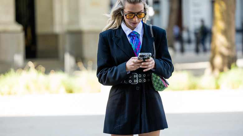 woman wearing a belted blazer dress