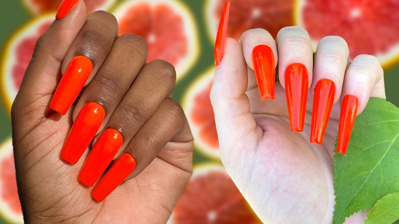 Woman with orange nails