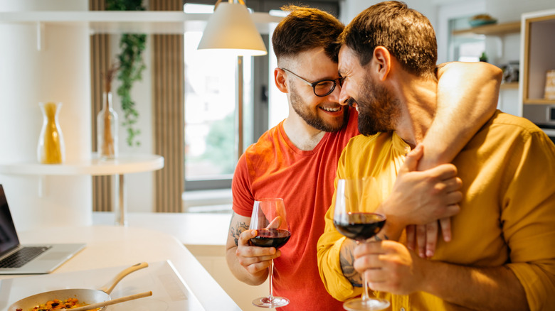 Two men hugging, laughing