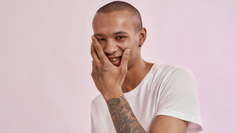 Man touching his face