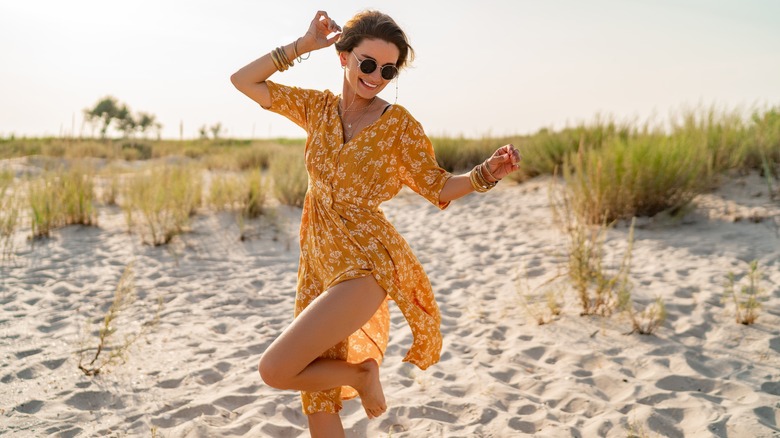 Woman playing in the sand