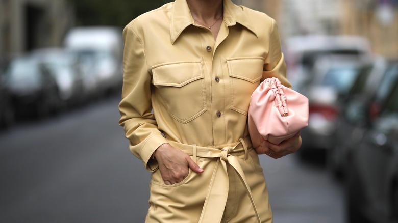 Anna Schürrle wearing beige boiler suit