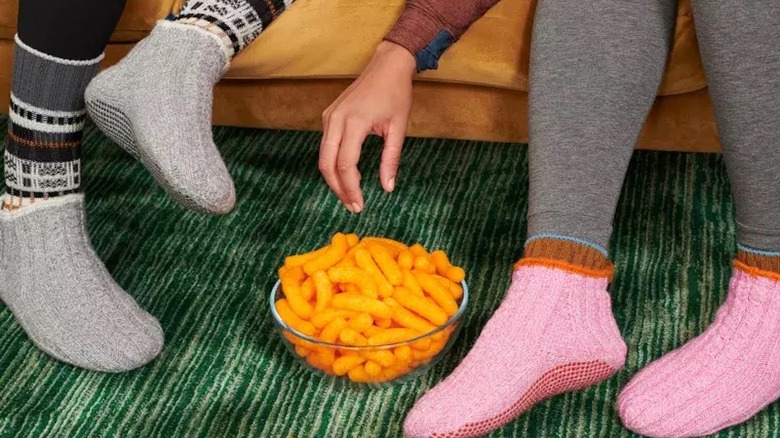 Two people wearing Bombas' socks