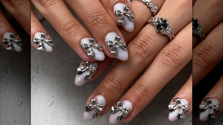 pearlescent almond nails silver bows