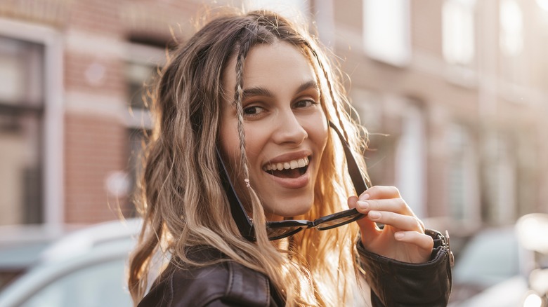 A woman with two thin braids