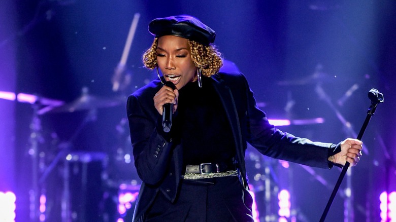 Brandy wearing a black beret with shorter blond locks