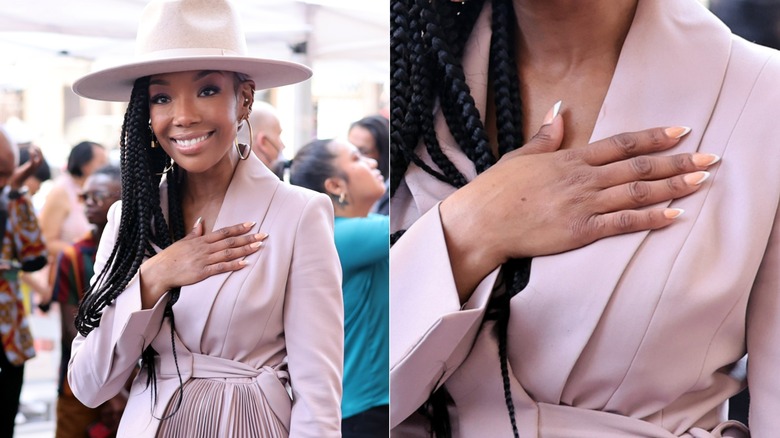 Brandy wearing a matching blush pink hat and dress