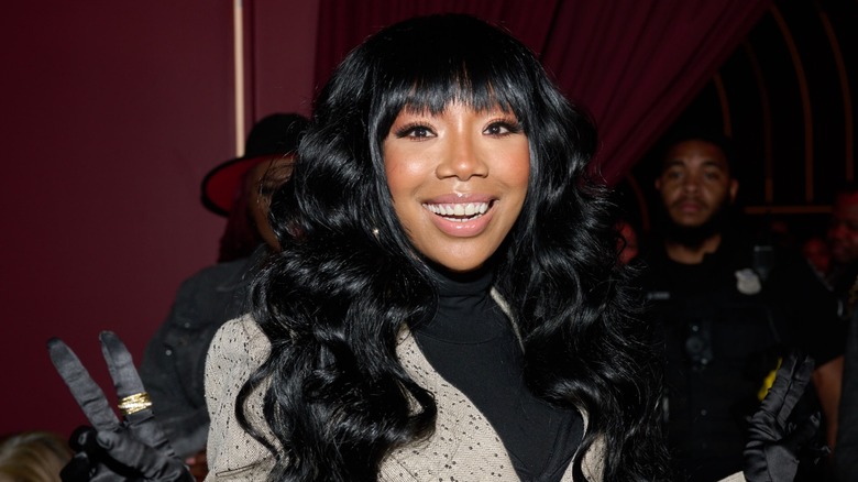 Brandy with long dark hair and blunt bangs