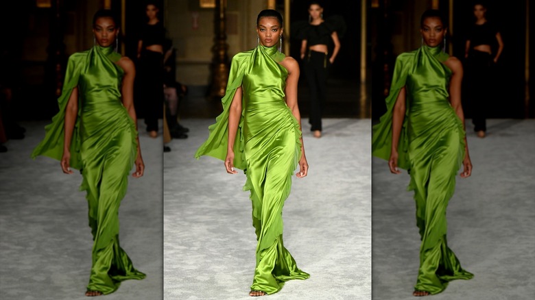 Model wearing bright satin dress