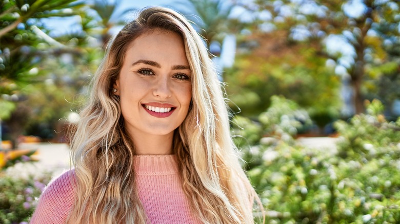 woman with blond hair smiling