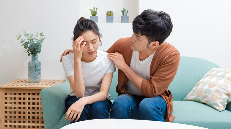 Husband comforting wife