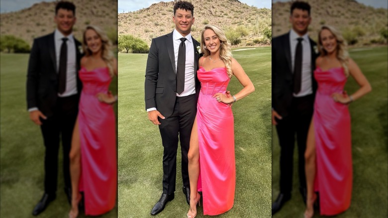 Brittany Mahomes and Patrick Mahomes posing at an outdoor wedding.